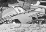 People, Cars and a Cratered Section of Road, 1964